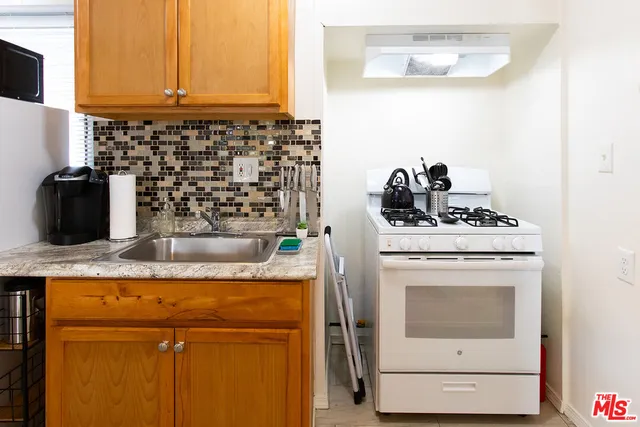 a kitchen with a stove and a microwave