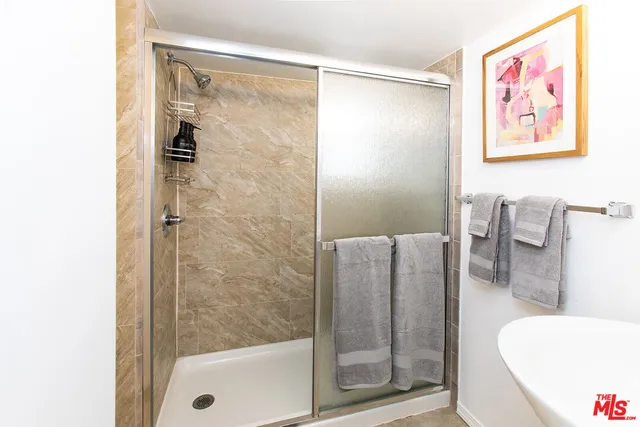 a bathroom with a shower and a tub