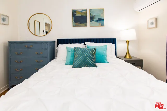 a bedroom with a bed and a closet