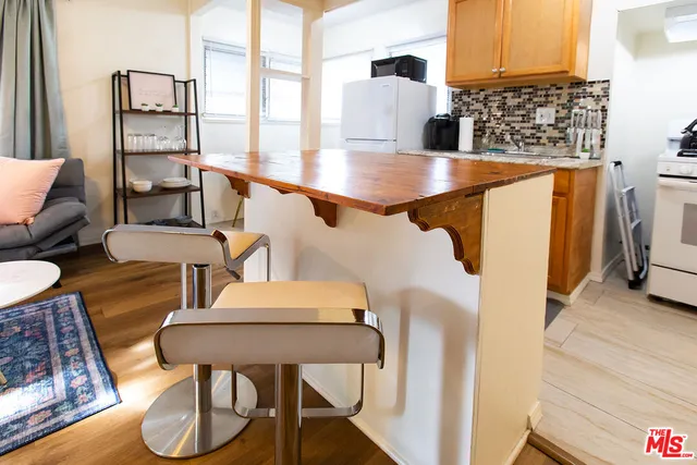 a balcony with table and chairs