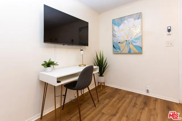 a view of a livingroom with furniture and flat screen tv