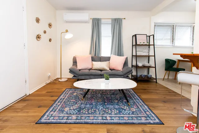 a living room with furniture and a rug