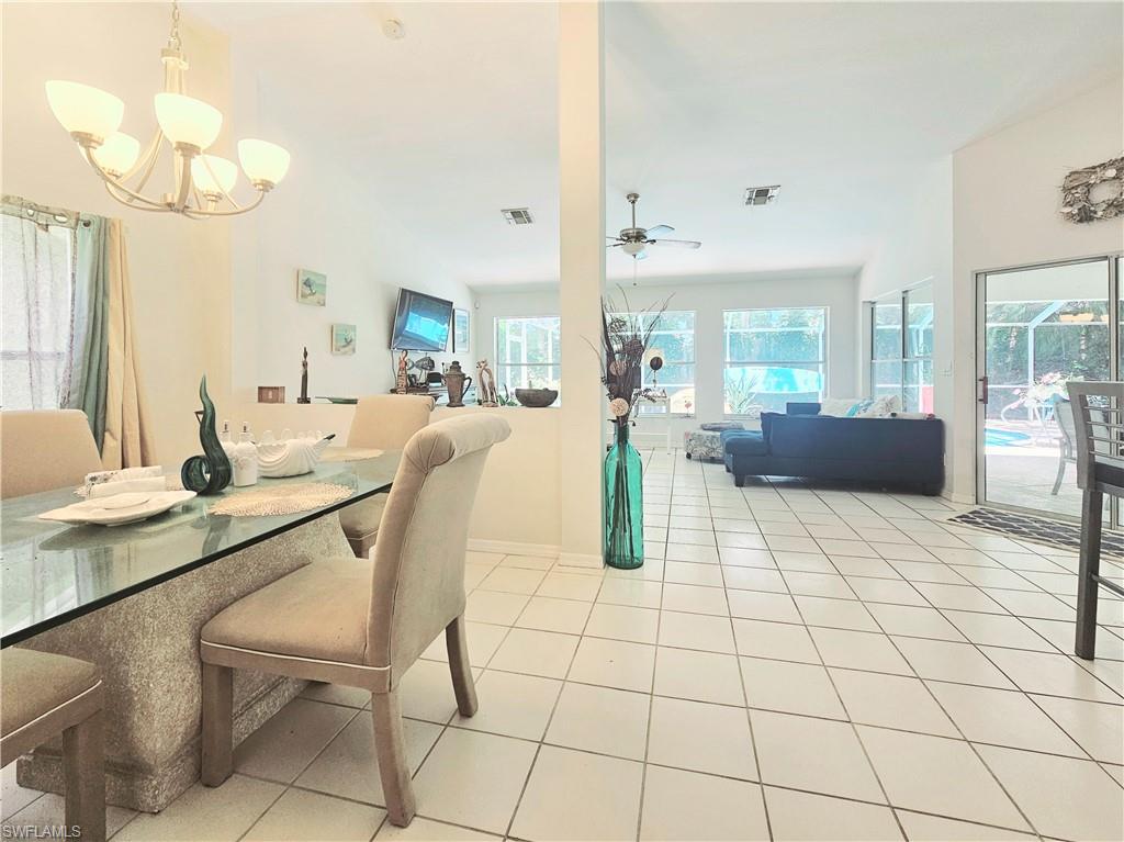 6708 Sloane Place Naples, FL 34104 - Photo 11 of 31 a view of a dining room with furniture