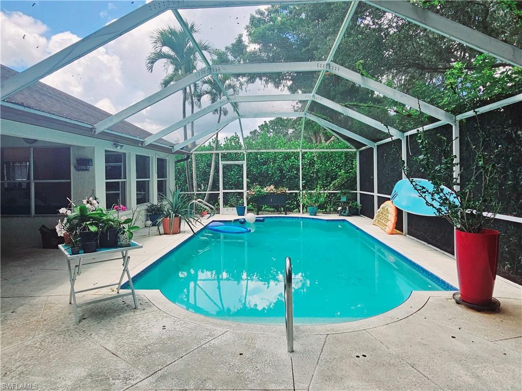 6708 Sloane Place Naples, FL 34104 - Photo 23 of 31 a view of a chairs and table in the patio