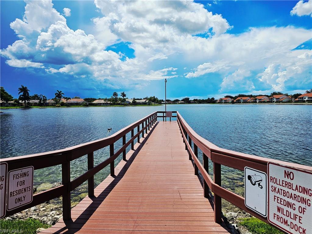 6708 Sloane Place Naples, FL 34104 - Photo 26 of 31 a view of bridge and lake