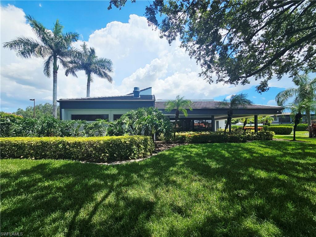 6708 Sloane Place Naples, FL 34104 - Photo 31 of 31 a view of a yard with a fountain