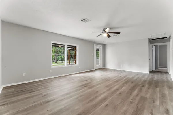 a view of an empty room with a window