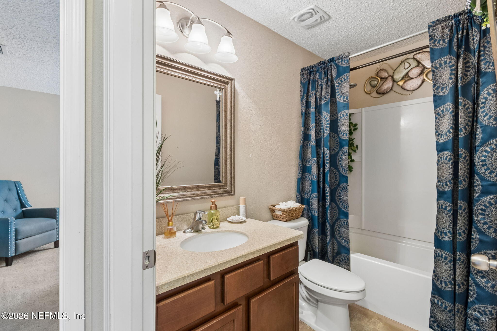 96034 Bass Lane Yulee, FL 32097 - Photo 36 of 50 a bathroom with a sink toilet and shower