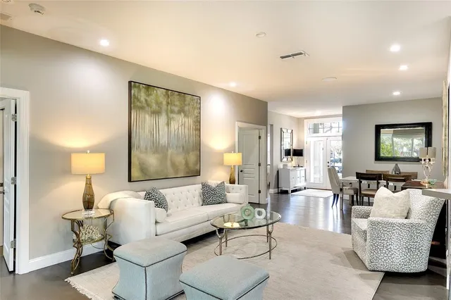 a living room with furniture and a lamp