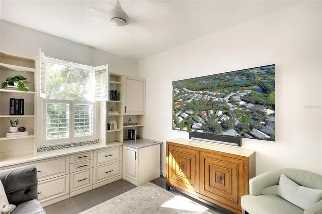 a living room with furniture and a large window