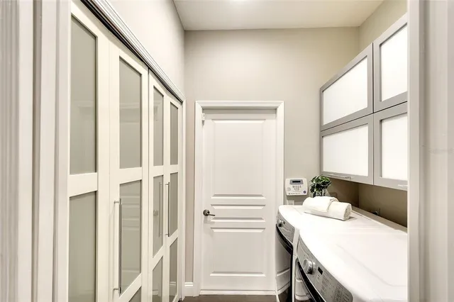 a kitchen with a table and chairs