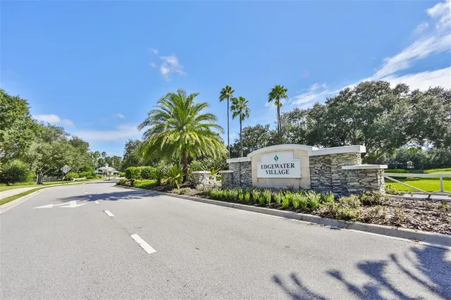 a front view of a house with a garden and a yard