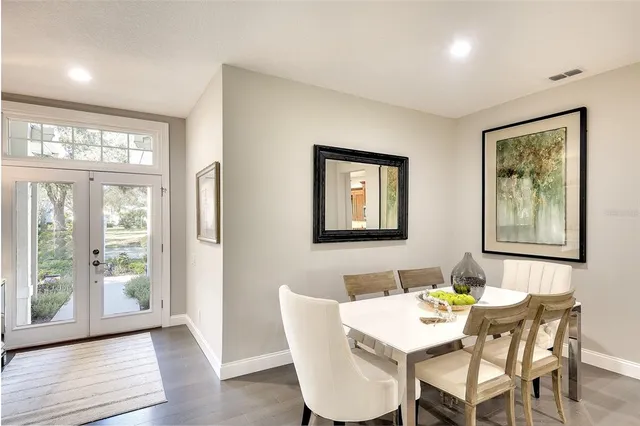 a view of a dining room with furniture wooden floor and a window