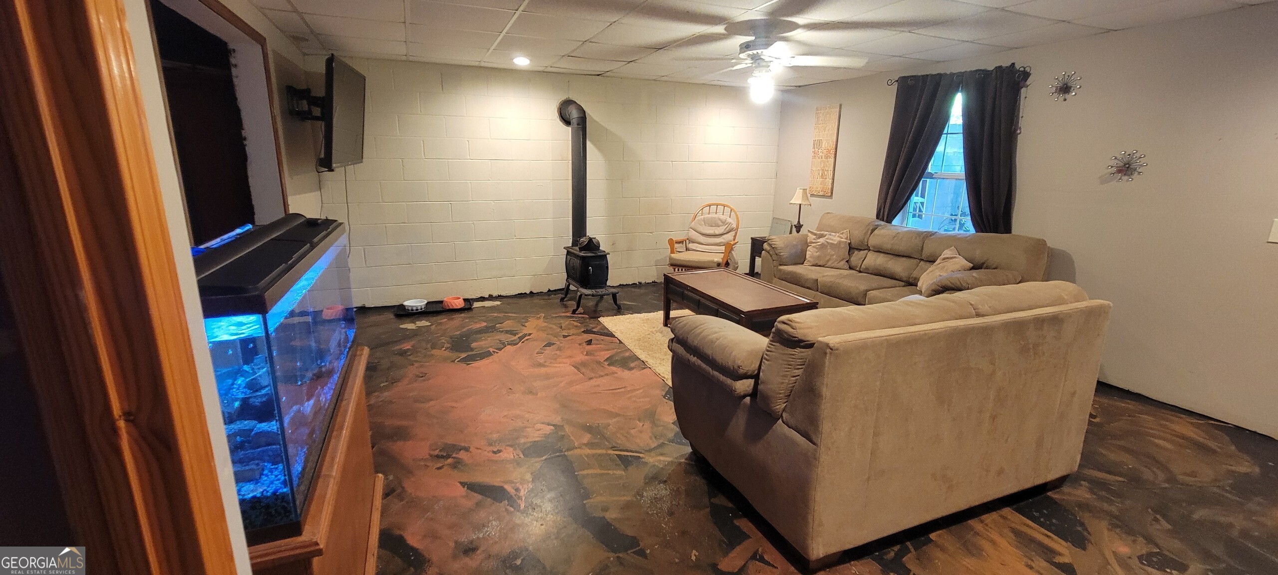 1605 Cody Road Mount Airy, GA 30563 - Photo 13 of 26 a living room with furniture and a flat screen tv