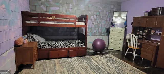 a bedroom with a bed and walk in closet