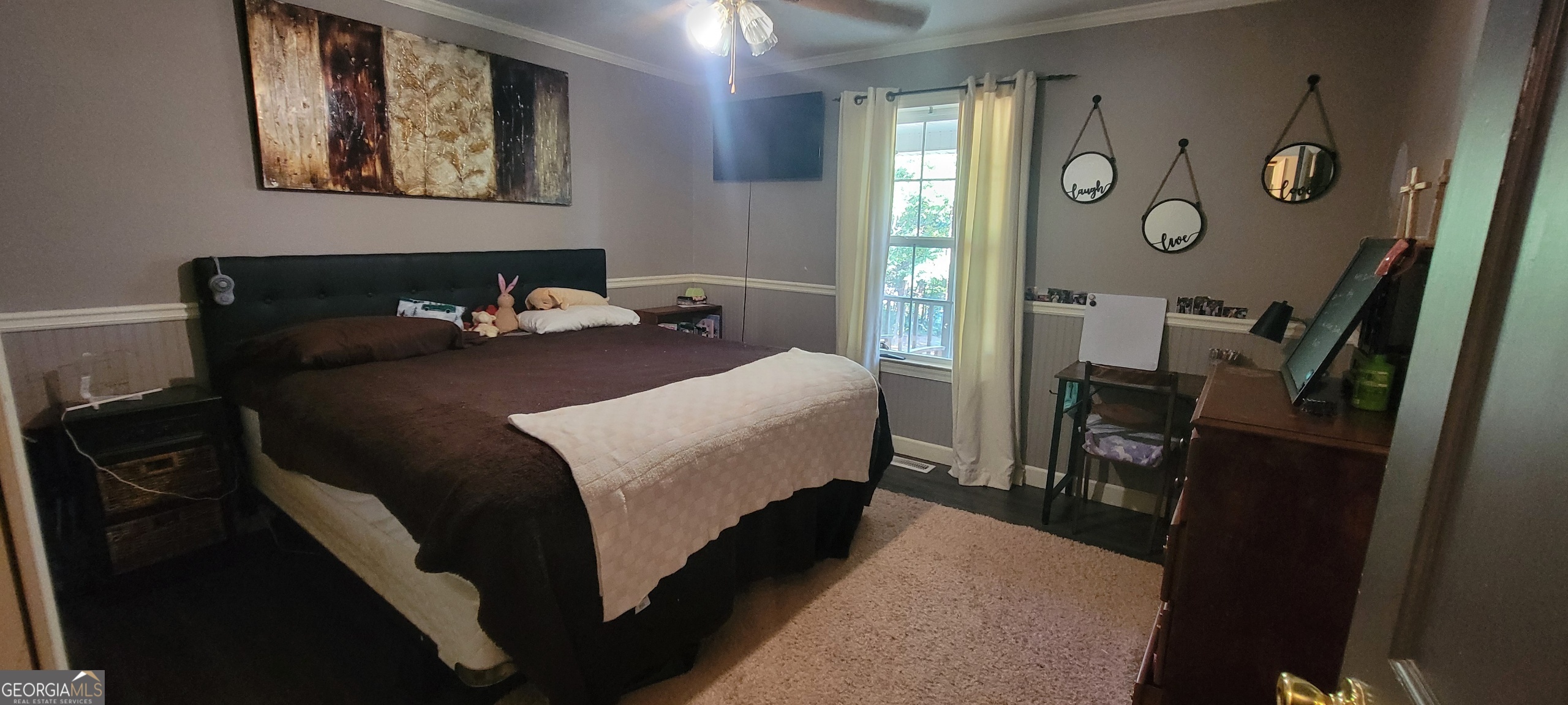 1605 Cody Road Mount Airy, GA 30563 - Photo 16 of 26 a bedroom with a bed and painting on the wall