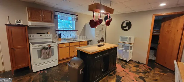 a kitchen with a stove and a refrigerator