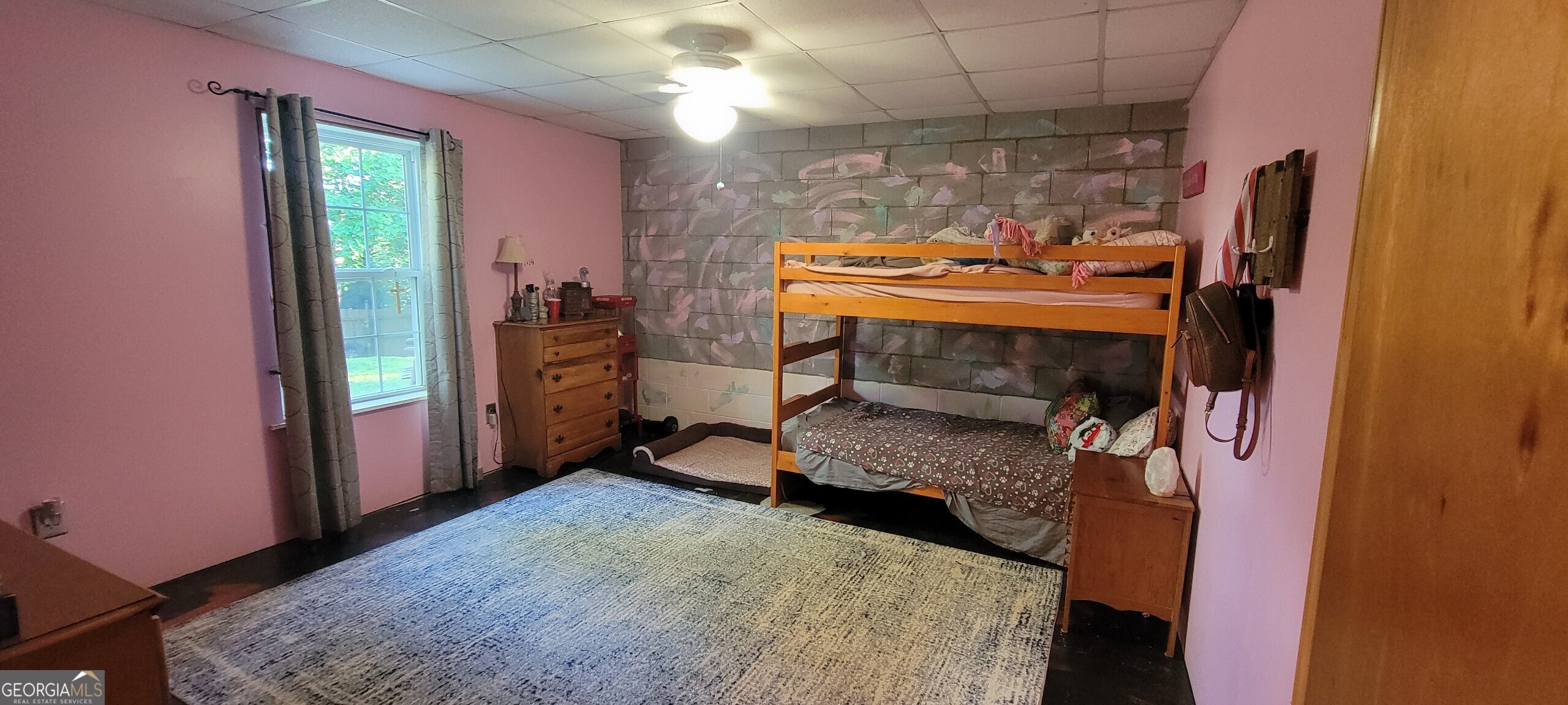 1605 Cody Road Mount Airy, GA 30563 - Photo 21 of 26 a bedroom with a bed and a window