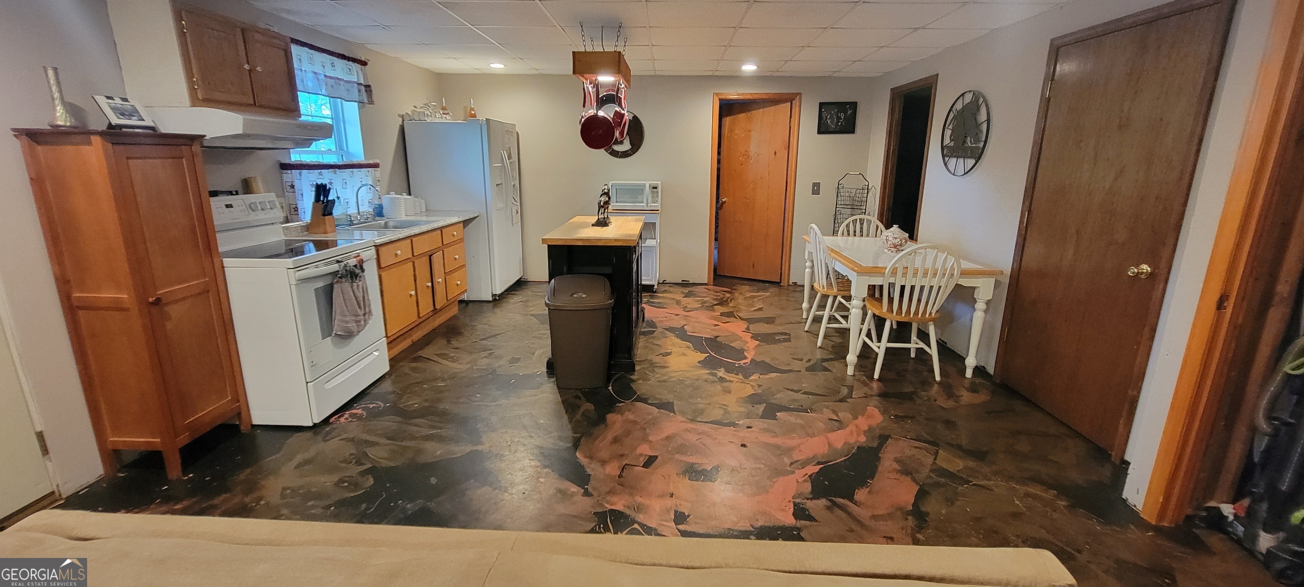 1605 Cody Road Mount Airy, GA 30563 - Photo 23 of 26 a living room with stainless steel appliances furniture a rug and a view of kitchen