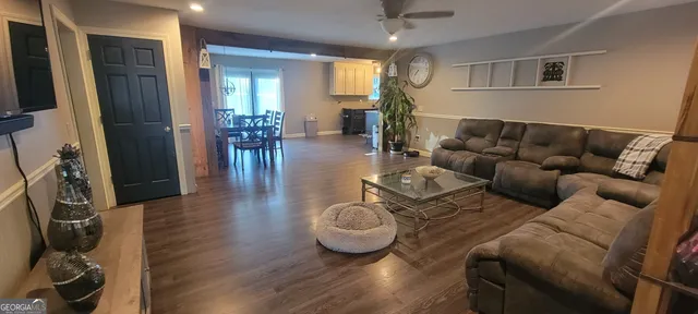 a living room with furniture and a table