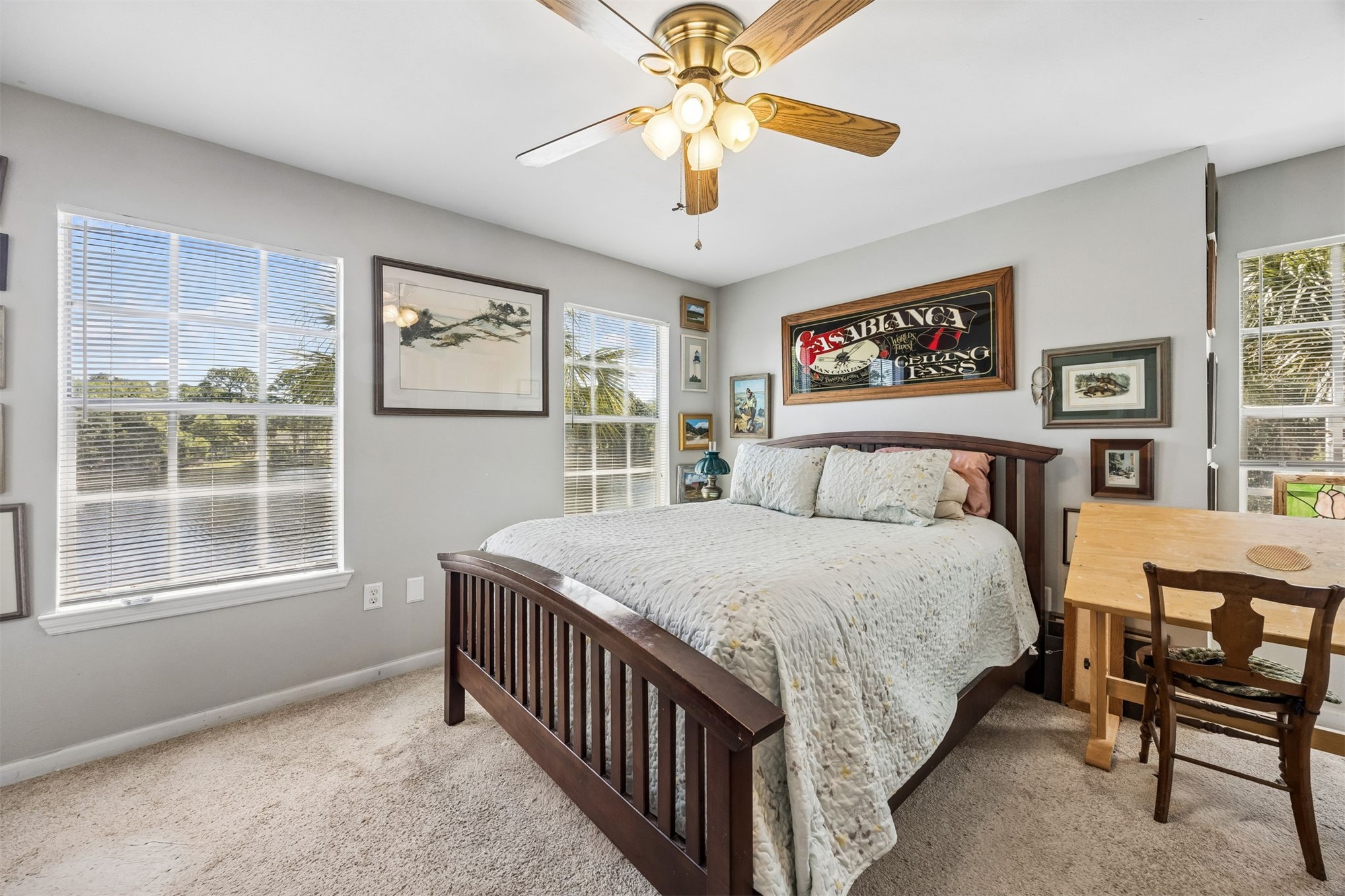 23525 Bahama Point, Unit 1621 Fernandina Beach, FL 32034 - Photo 13 of 68 a bedroom with a bed and a chandelier
