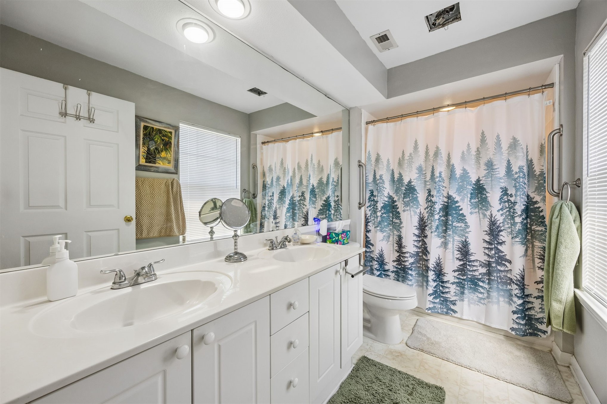 23525 Bahama Point, Unit 1621 Fernandina Beach, FL 32034 - Photo 16 of 68 a bathroom with double vanity sink a mirror and a shower