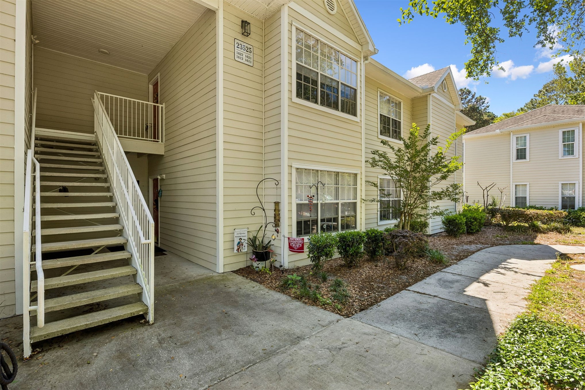 23525 Bahama Point, Unit 1621 Fernandina Beach, FL 32034 - Photo 2 of 68 a view of a house with backyard and garden