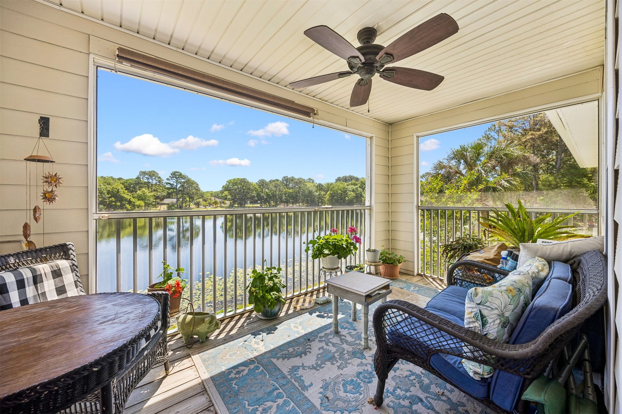 23525 Bahama Point, Unit 1621 Fernandina Beach, FL 32034 - Photo 24 of 68 a living room with furniture floor to ceiling windows and a table