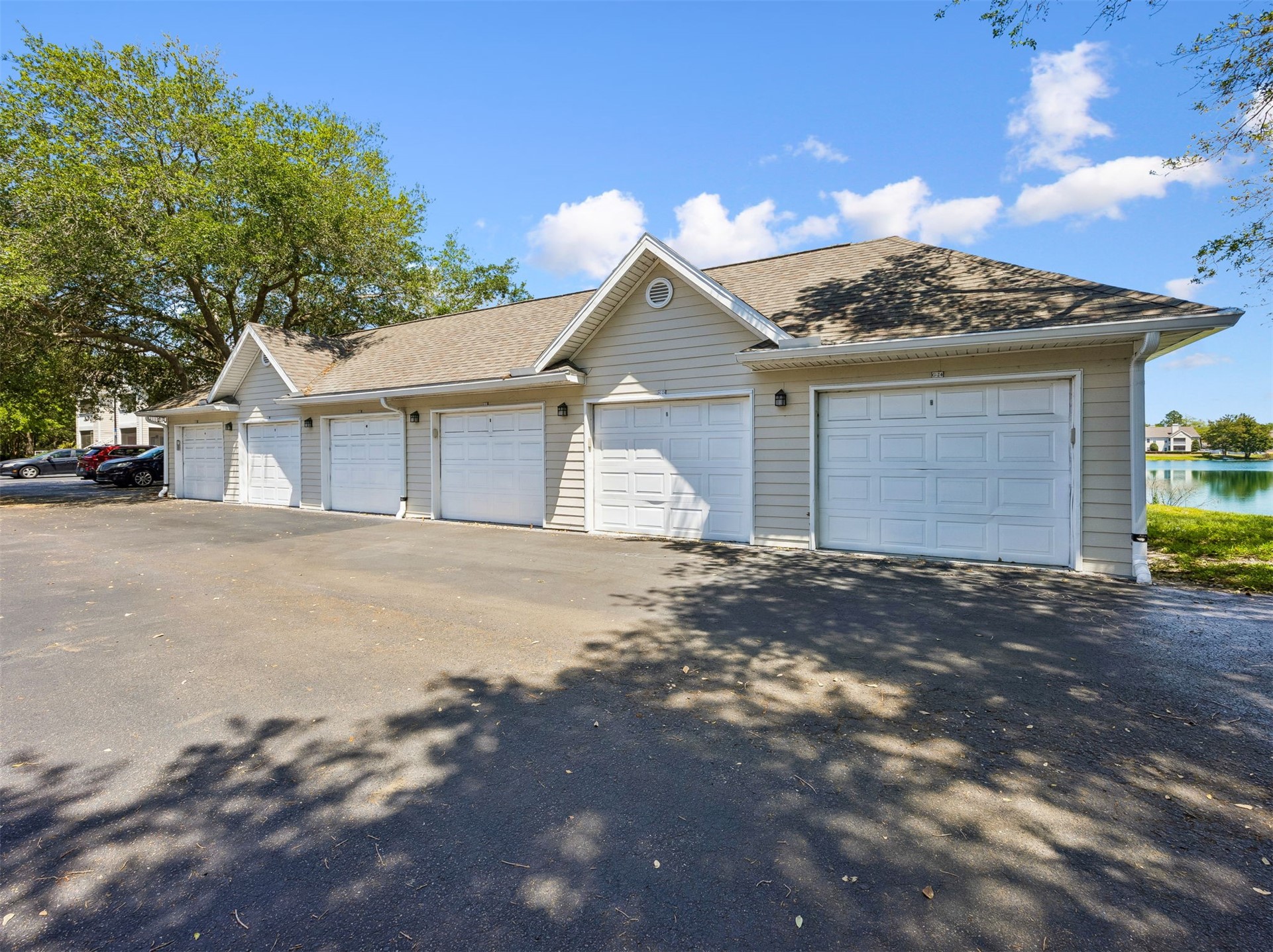 23525 Bahama Point, Unit 1621 Fernandina Beach, FL 32034 - Photo 26 of 68 a front view of a house with a yard and garage