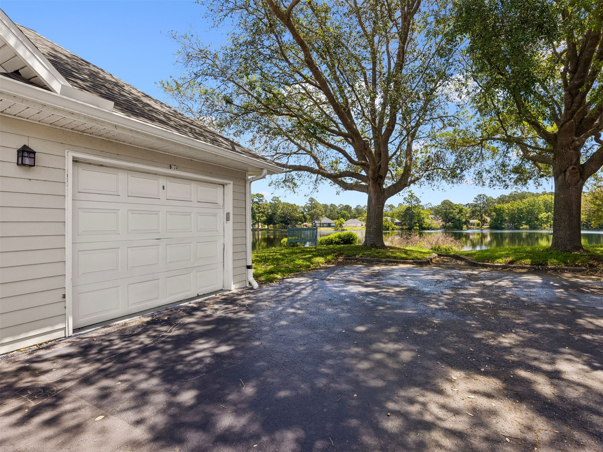 23525 Bahama Point, Unit 1621 Fernandina Beach, FL 32034 - Photo 27 of 68 a view of a backyard with large trees