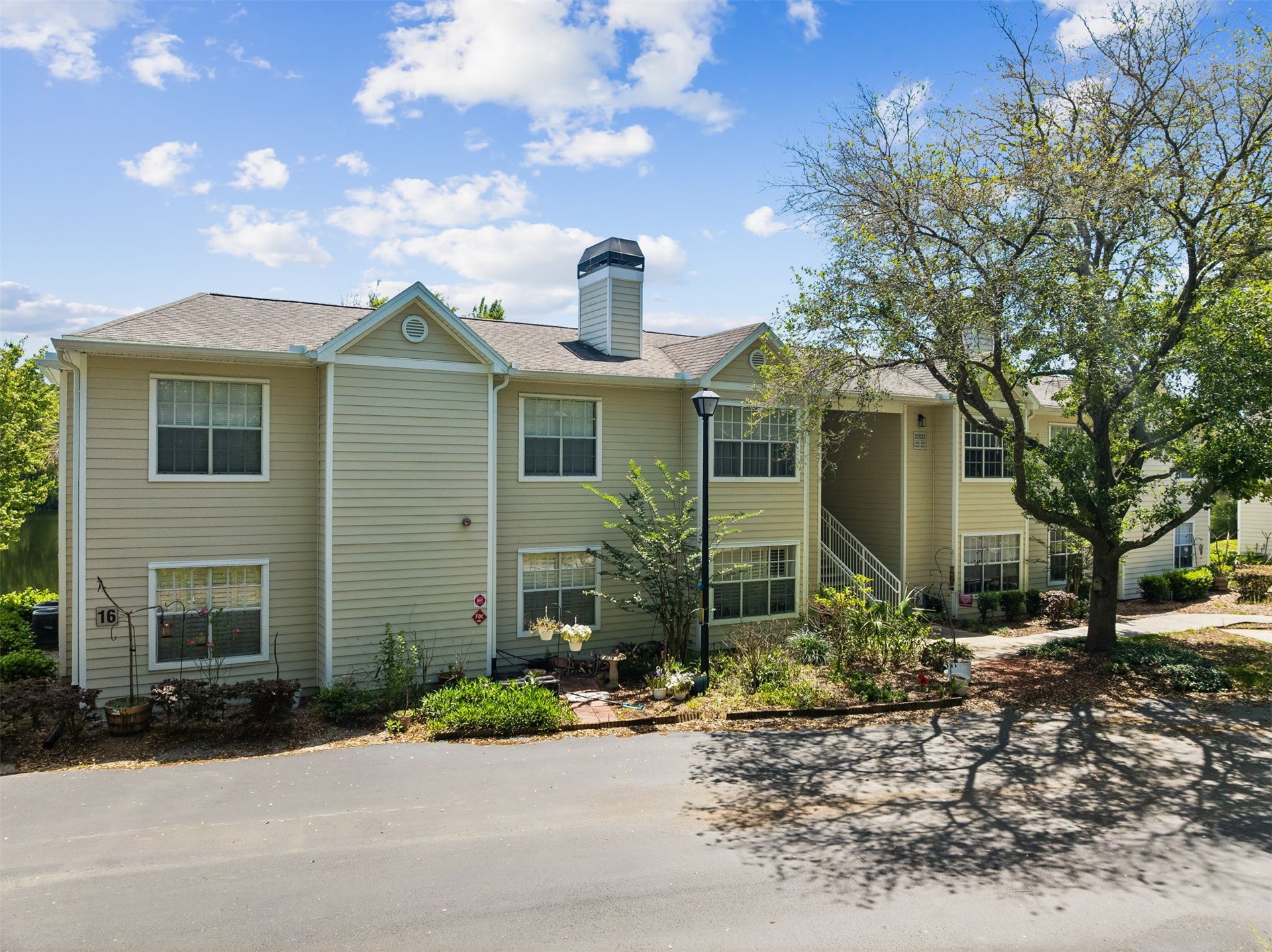 23525 Bahama Point, Unit 1621 Fernandina Beach, FL 32034 - Photo 28 of 68 a front view of a house with garden