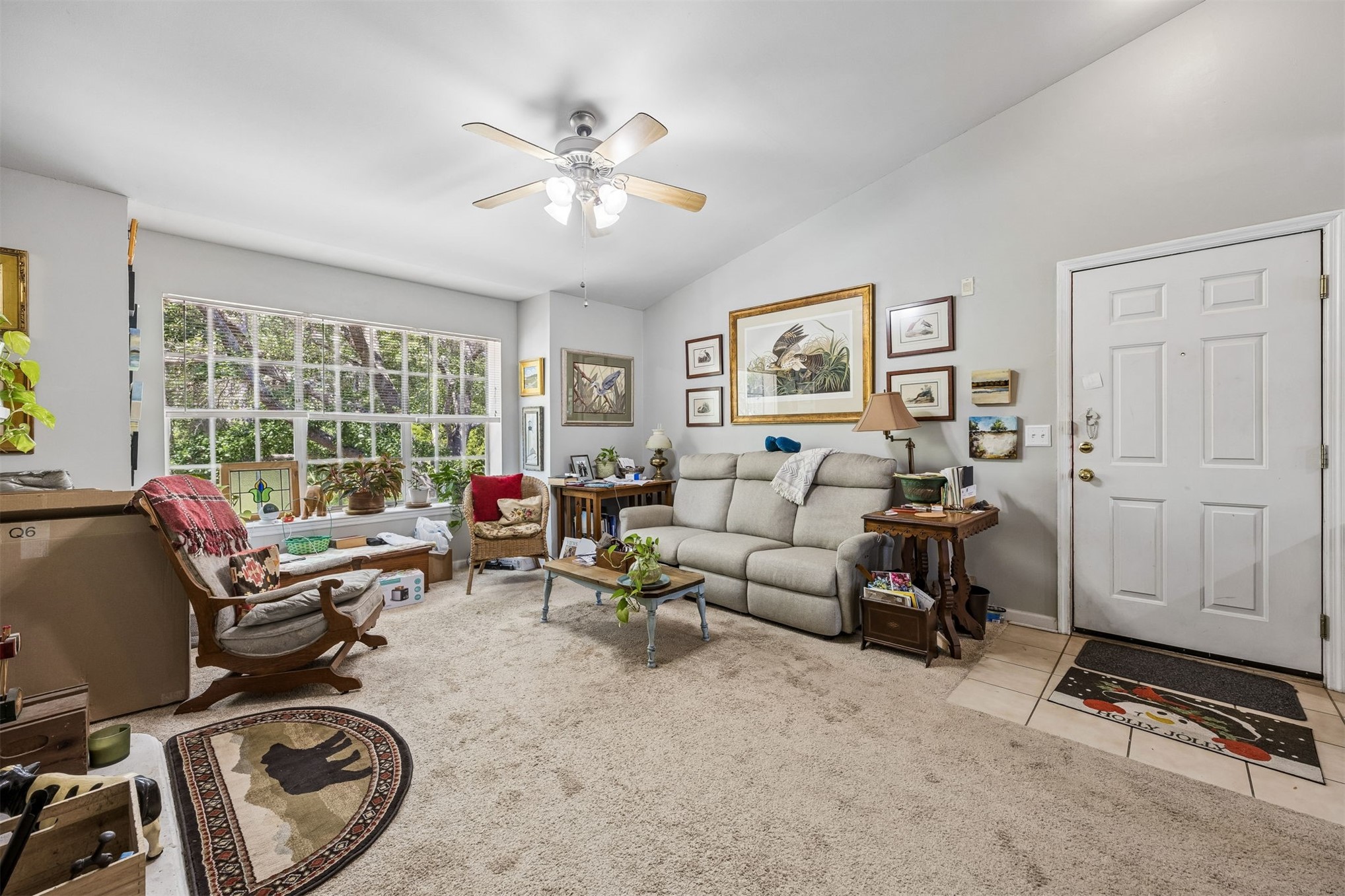 23525 Bahama Point, Unit 1621 Fernandina Beach, FL 32034 - Photo 3 of 68 a living room with furniture a floor to ceiling window and a flat screen tv