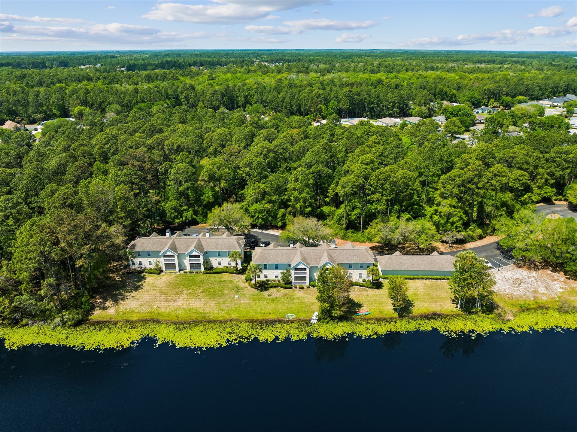 23525 Bahama Point, Unit 1621 Fernandina Beach, FL 32034 - Photo 39 of 68 a view of a house with yard and lake view