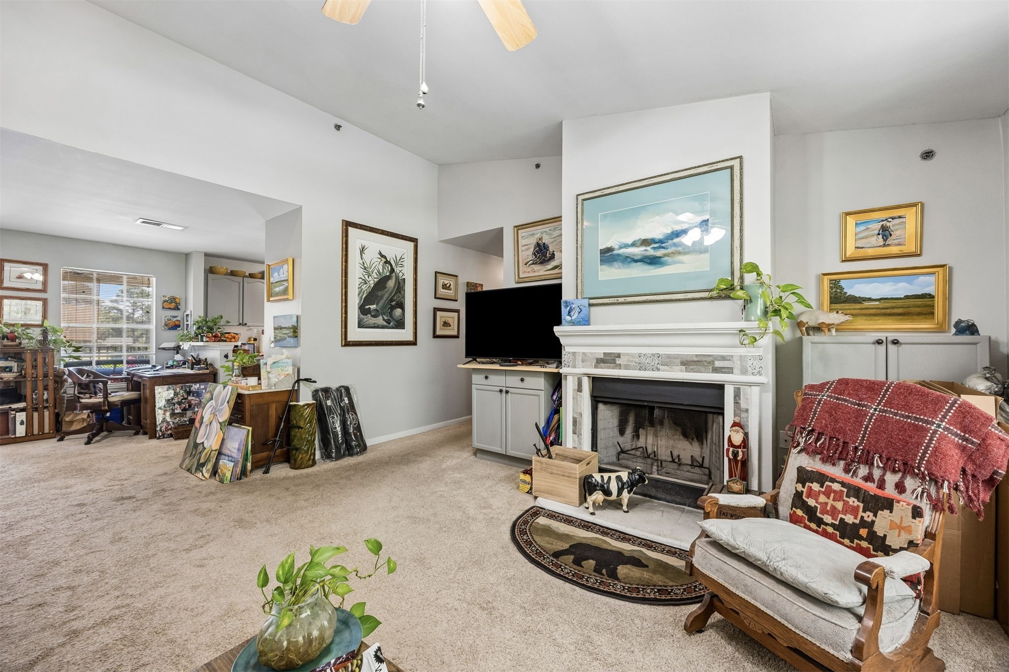 23525 Bahama Point, Unit 1621 Fernandina Beach, FL 32034 - Photo 4 of 68 a living room with furniture a flat screen tv and a fireplace