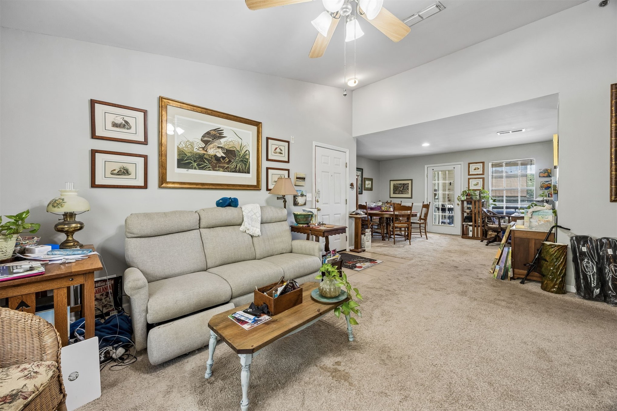 23525 Bahama Point, Unit 1621 Fernandina Beach, FL 32034 - Photo 5 of 68 a living room with furniture and a dining table with wooden floor