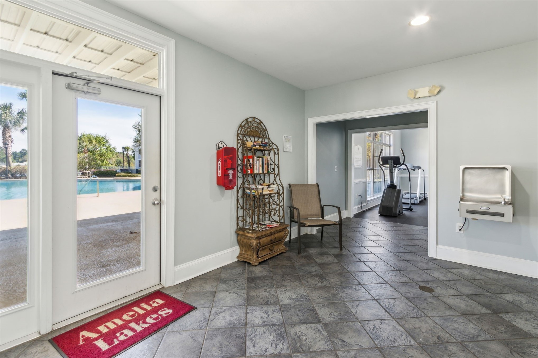 23525 Bahama Point, Unit 1621 Fernandina Beach, FL 32034 - Photo 51 of 68 a view of a hallway with workspace and livingroom view