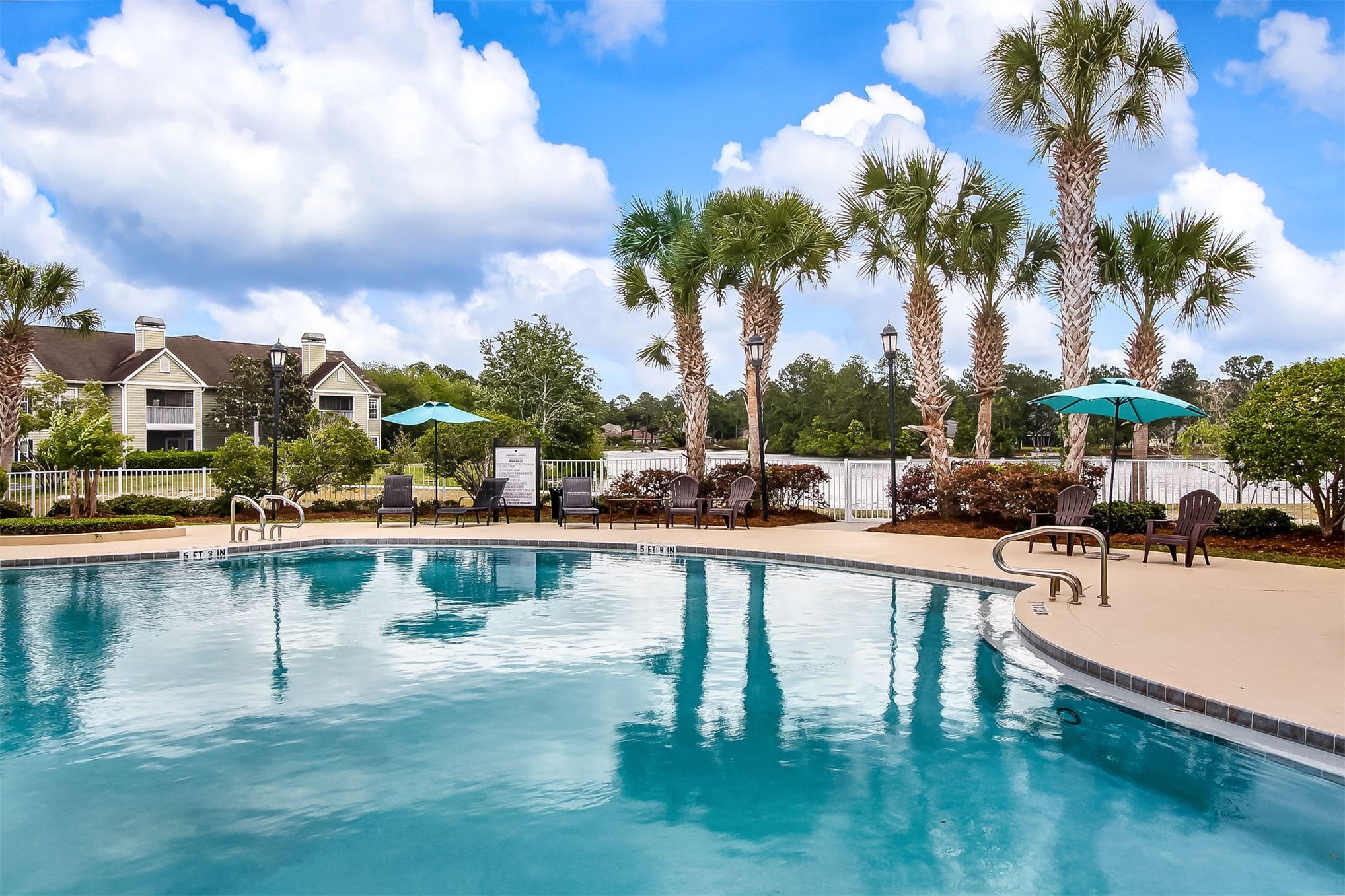 23525 Bahama Point, Unit 1621 Fernandina Beach, FL 32034 - Photo 56 of 68 a view of swimming pool with outdoor seating and lake view