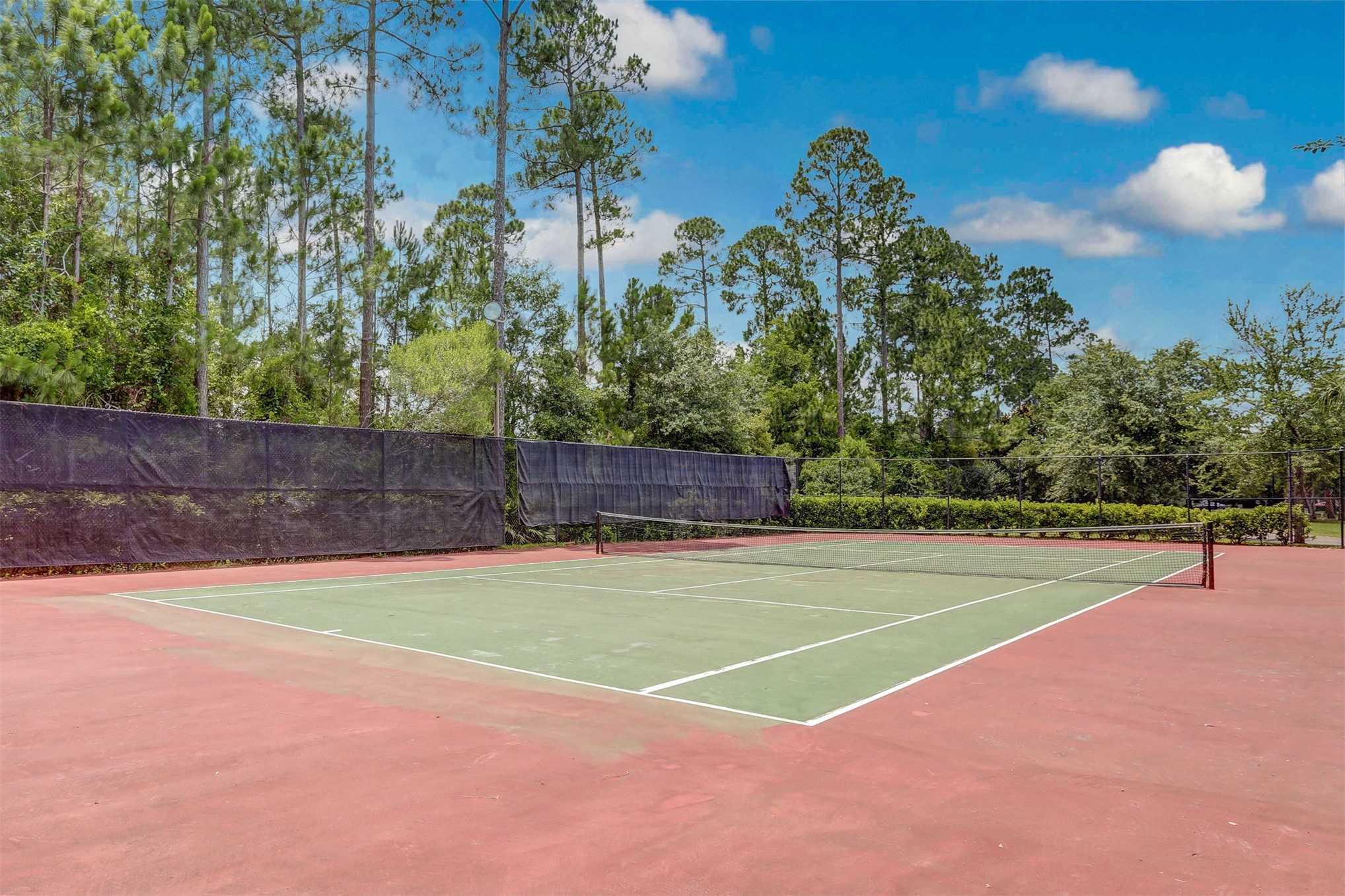 23525 Bahama Point, Unit 1621 Fernandina Beach, FL 32034 - Photo 63 of 68 a view of a tennis court