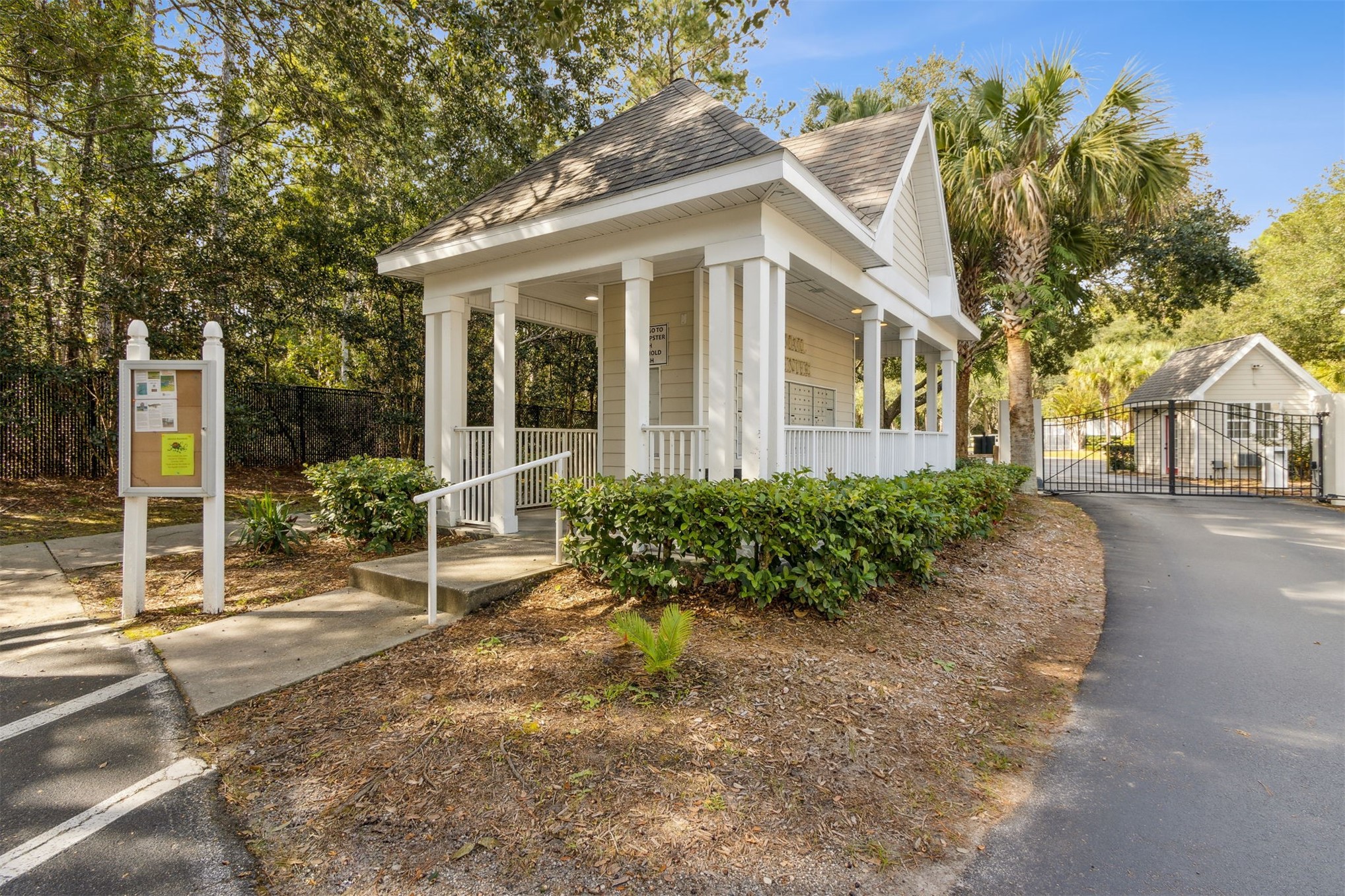 23525 Bahama Point, Unit 1621 Fernandina Beach, FL 32034 - Photo 66 of 68 a view of a white house with large windows next to a road