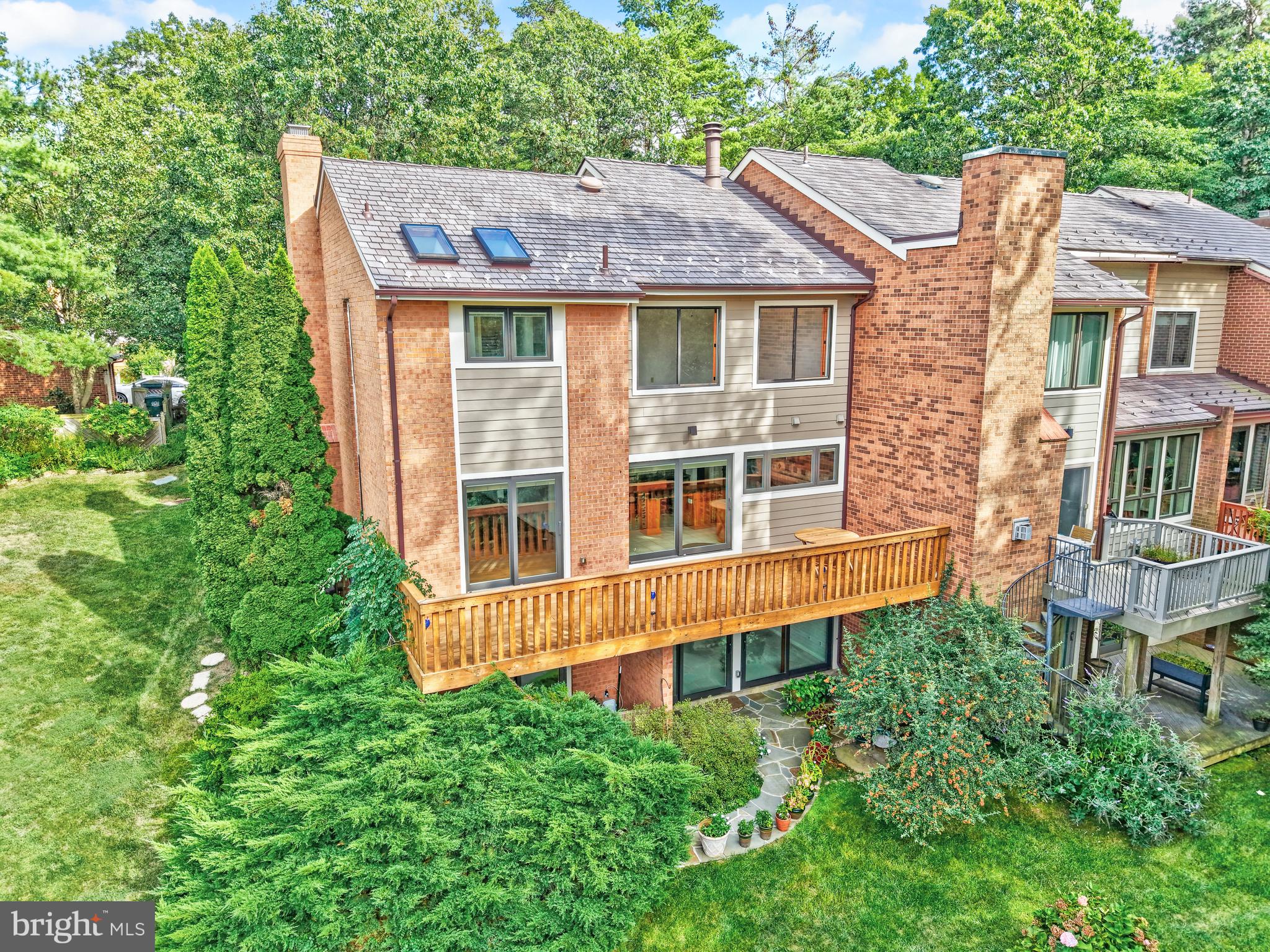11088 Glade Court Reston, VA 20191 - Photo 72 of 75 a front view of a house with a garden