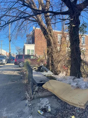 a view of a car parked in the road