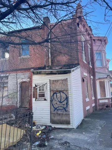 a front view of a house with parking space