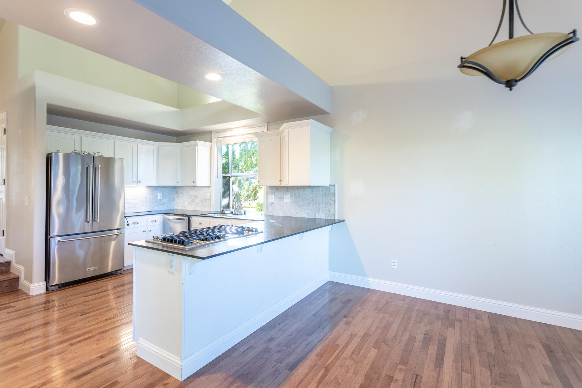 3126 Riesling Path Redding, CA 96001 - Photo 6 of 32 a kitchen with a sink and wooden floor