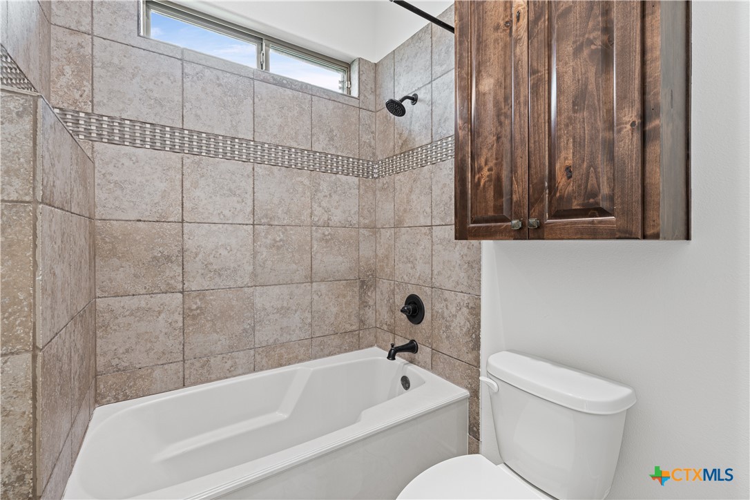 11023 Bigham Road Troy, TX 76579 - Photo 28 of 42 a bathroom with a toilet bathtub and shower