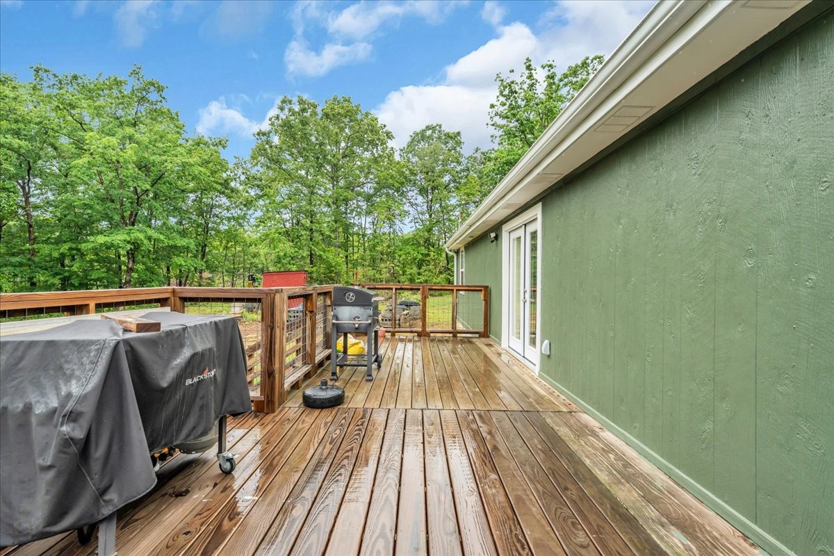 802 Meyers Road Altamont, TN 37301 - Photo 29 of 30 a balcony with wooden floor and outdoor seating