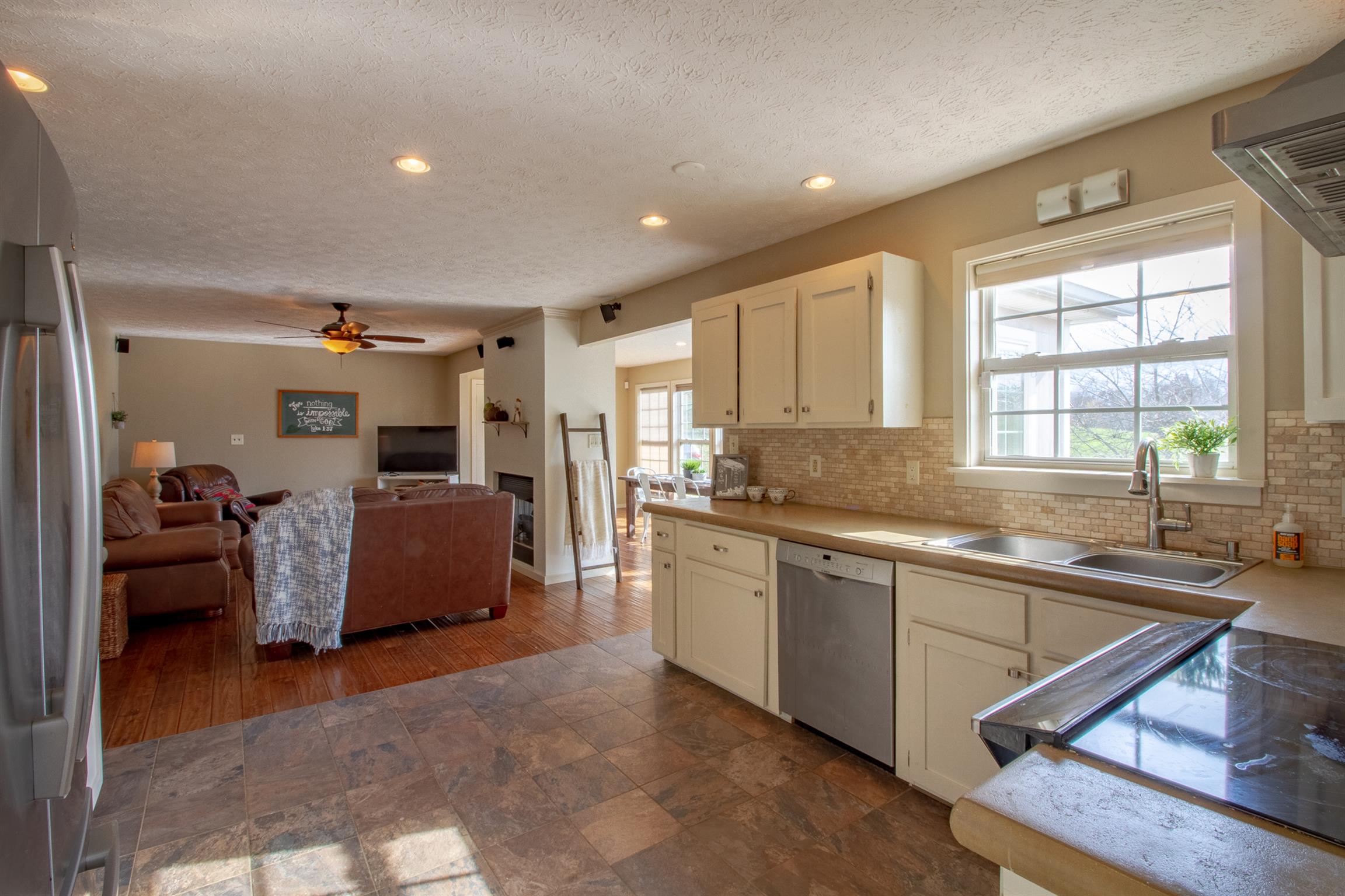 6990 Hoods Branch Road Springfield, TN 37172 - Photo 13 of 23 a large white kitchen with sink and a large window