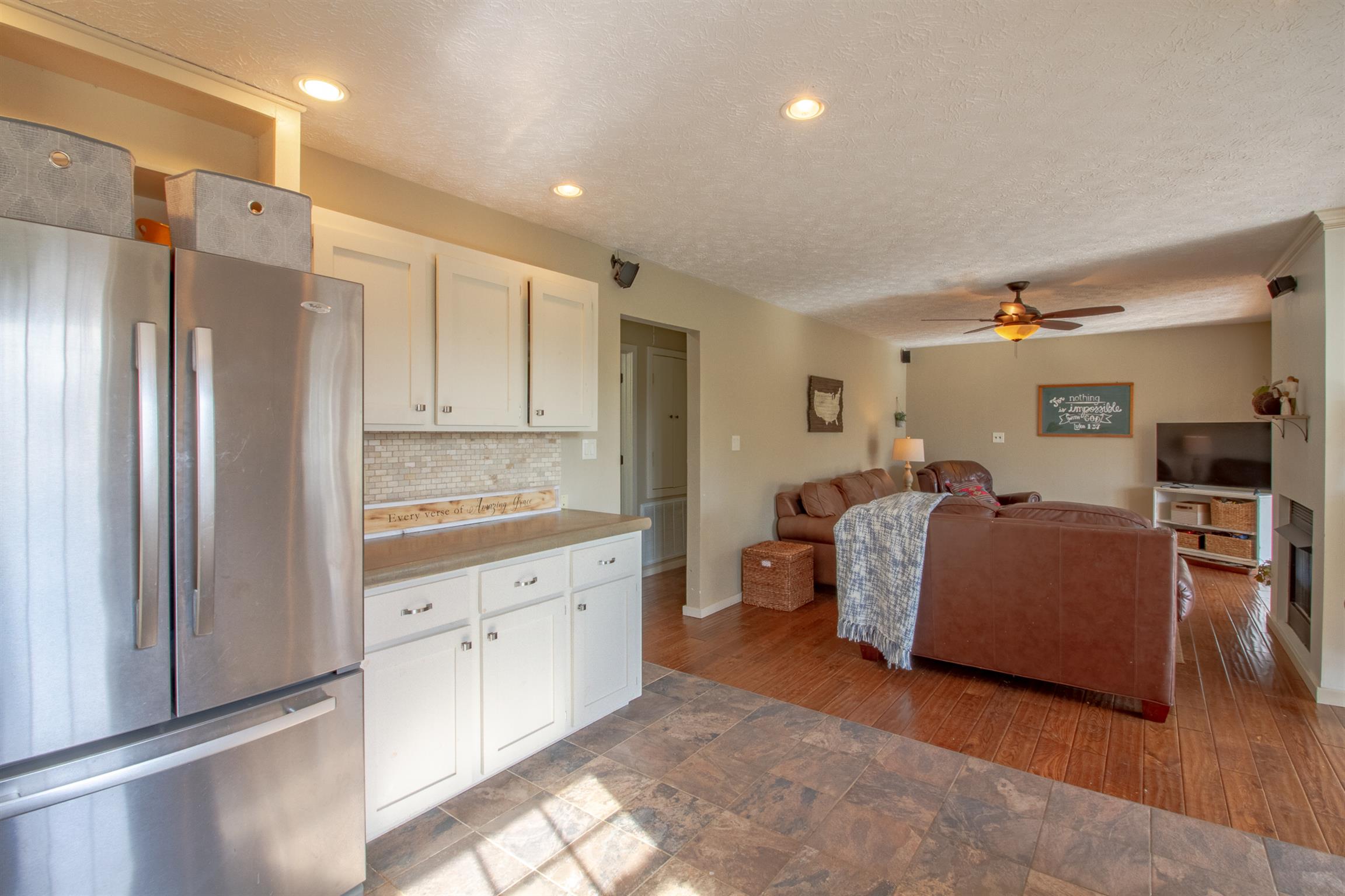 6990 Hoods Branch Road Springfield, TN 37172 - Photo 14 of 23 a living room with kitchen island granite countertop furniture and a refrigerator