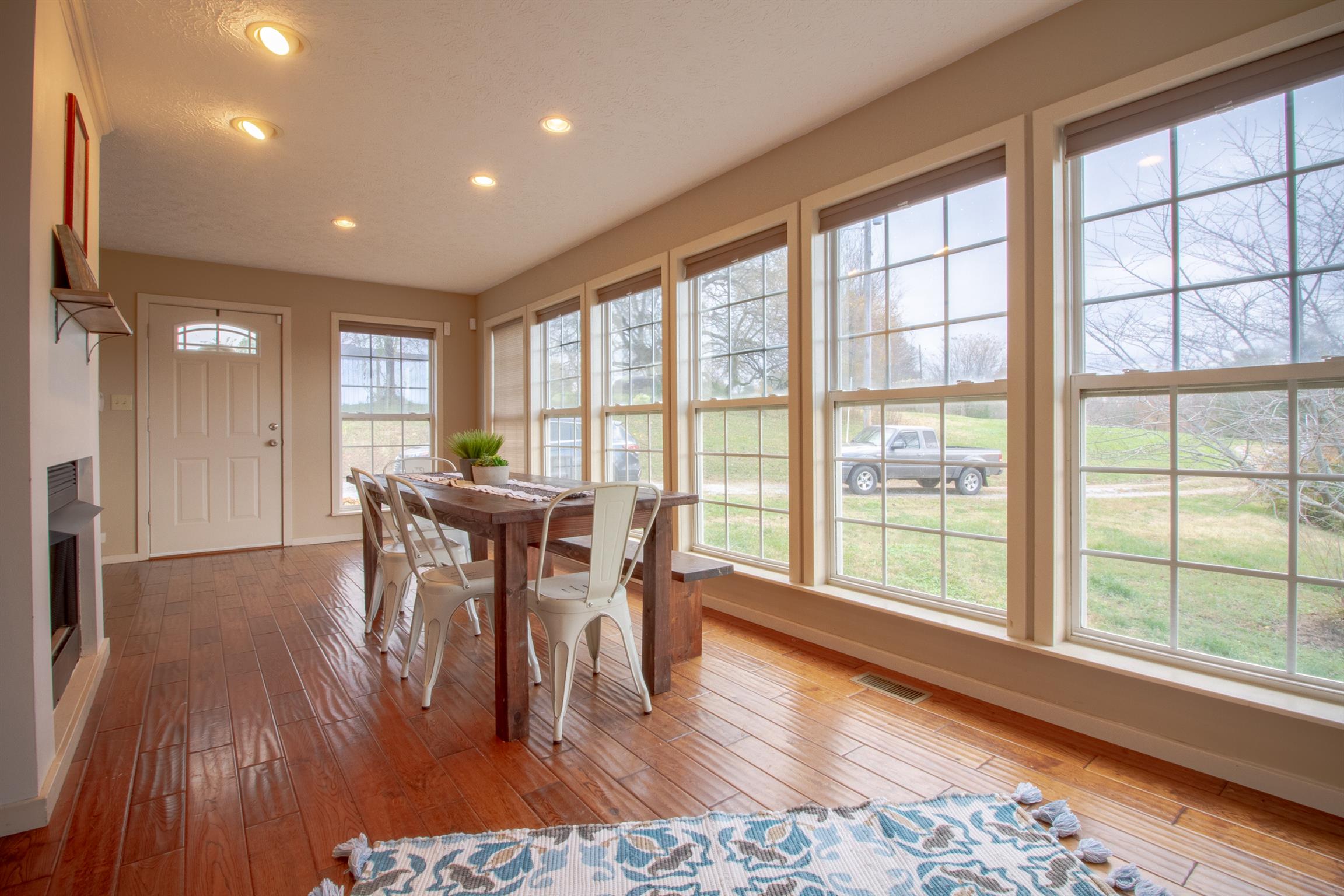 6990 Hoods Branch Road Springfield, TN 37172 - Photo 6 of 23 a view of a a dining room with furniture window and wooden floor