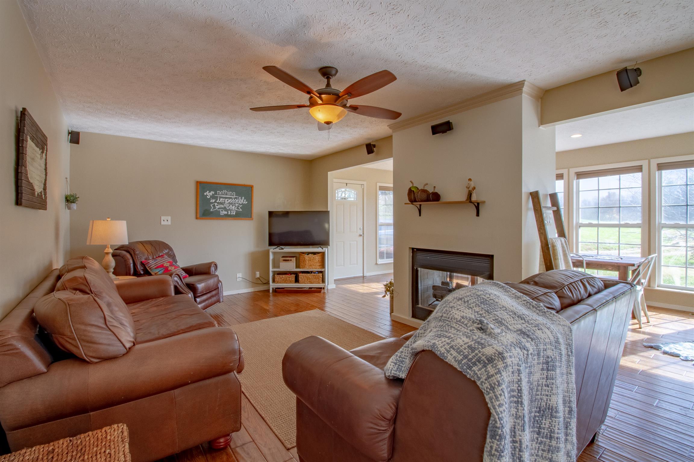 6990 Hoods Branch Road Springfield, TN 37172 - Photo 10 of 23 a living room with furniture a ceiling fan and a window