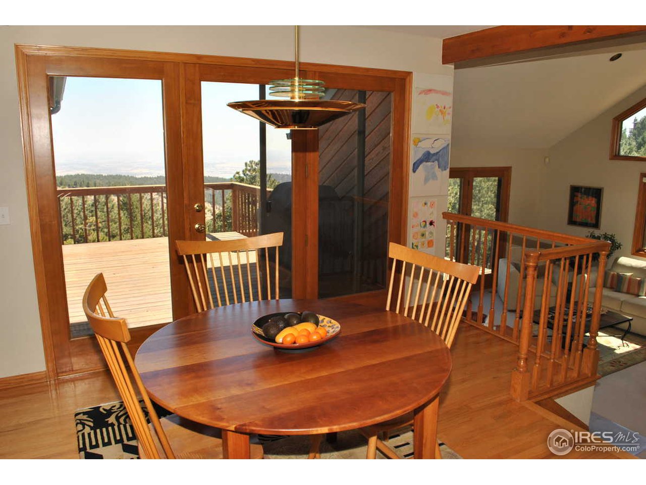 716 Brook Road Boulder, CO 80302 - Photo 12 of 25 a view of a dining room with furniture window and wooden floor